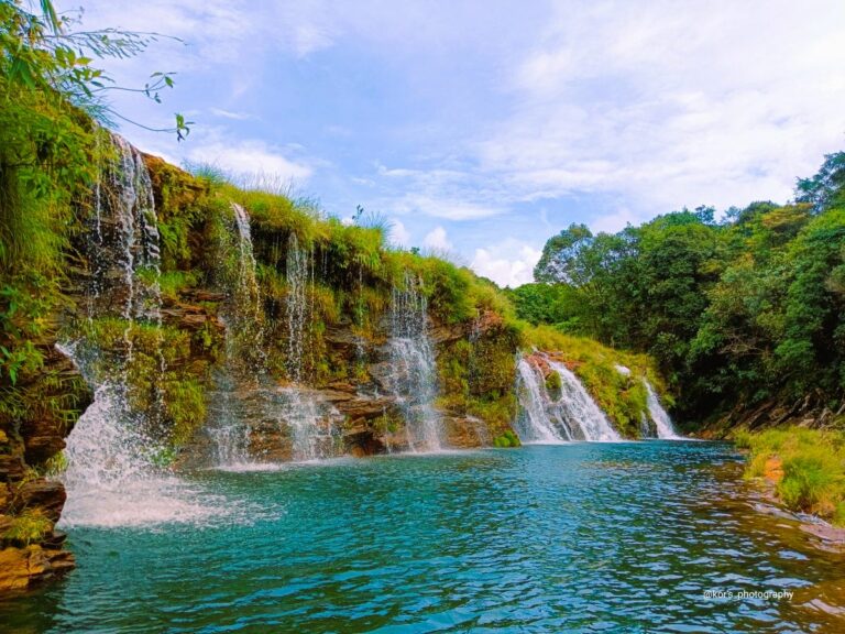Hidden Wahrashi Waterfall surrounded by dense forest in Meghalaya
