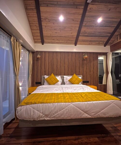 Elegant executive room with plush bedding, workspace, and modern amenities.