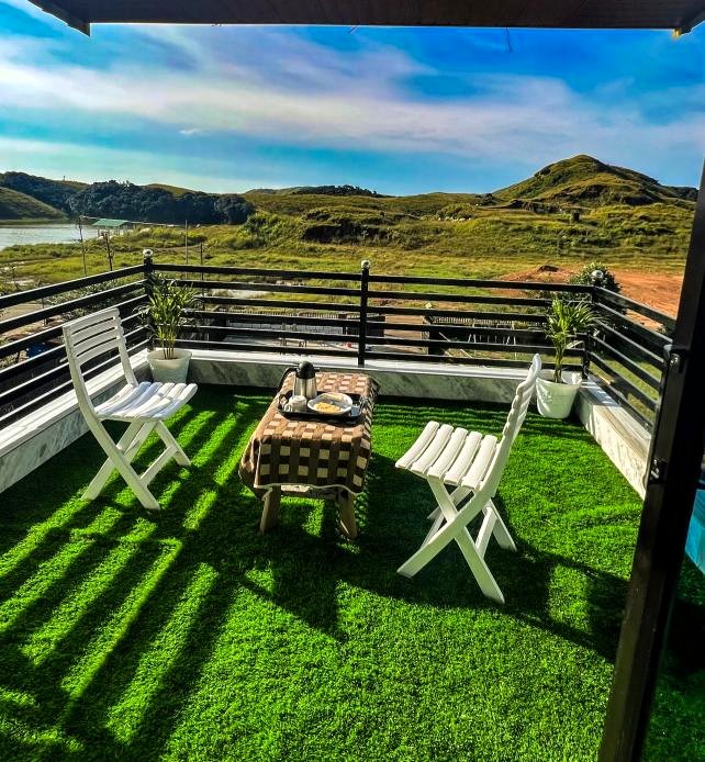 Outer view of the property with scenic surroundings and welcoming entrance.