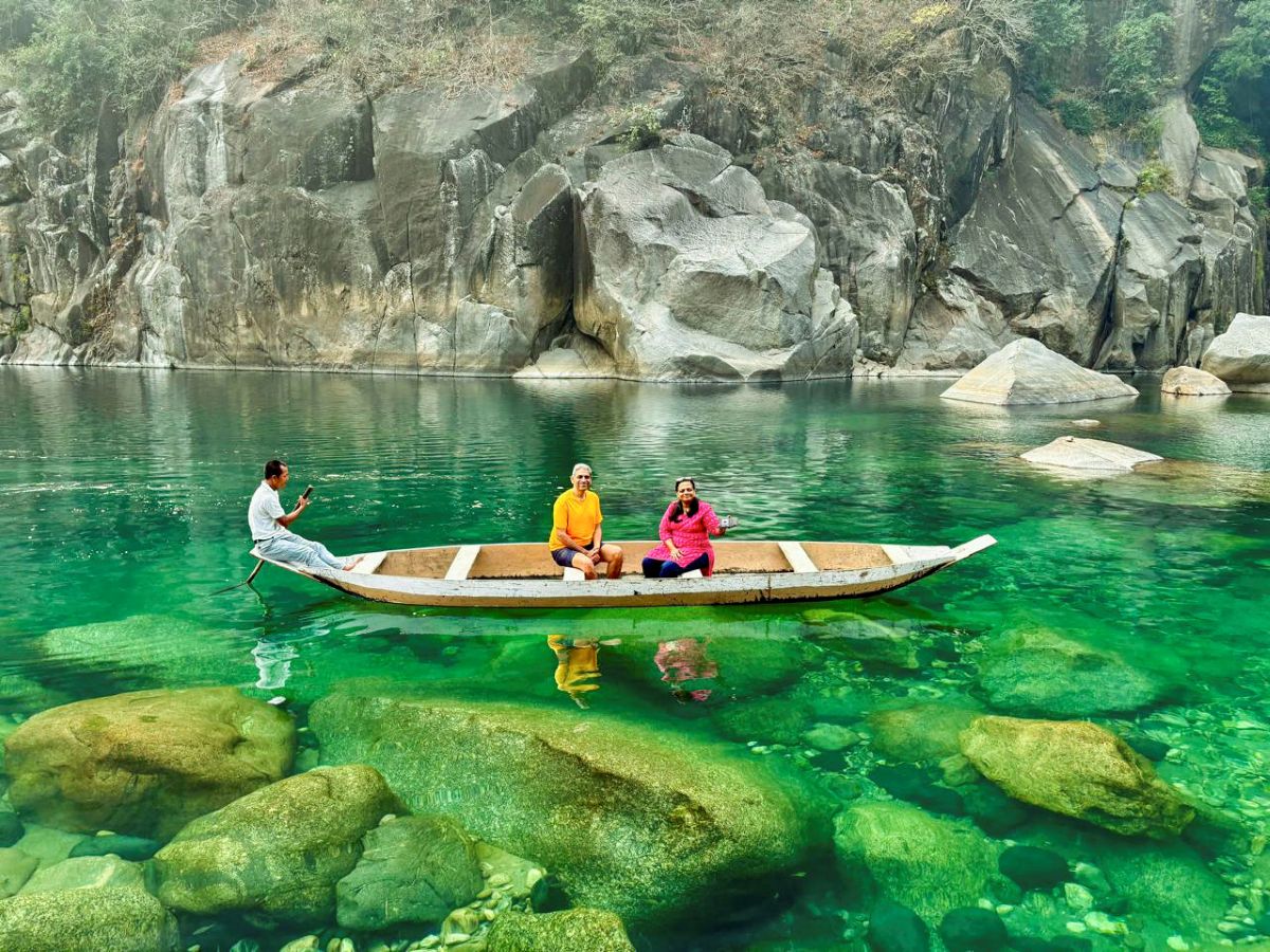 tourist boating on the transparent umgot river in dawki