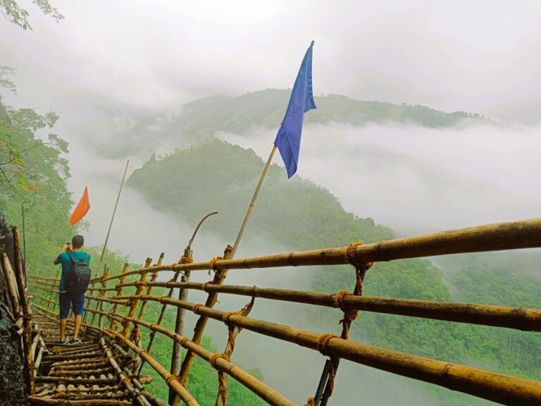 Scenic view of cliffs and bamboo pathways on the Mawryngkhang Trail.