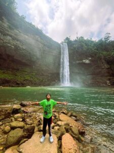 Kid enjoying a nature outing at the scenic Phe Phe Waterfall