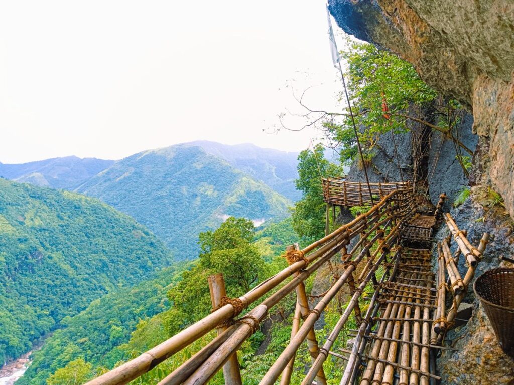 Adventure trail in Wahkhen with bamboo bridges and deep valley views.